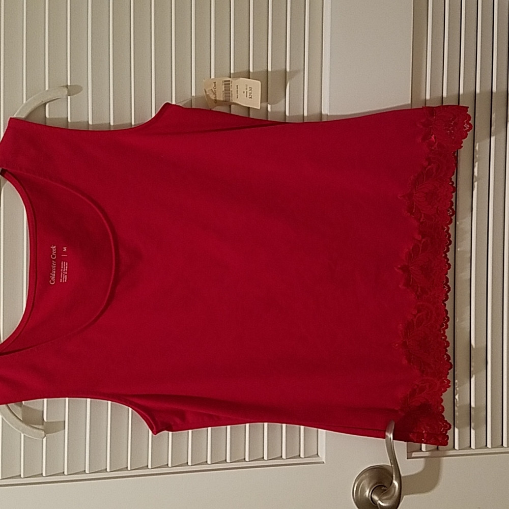 Sleeveless womens top sz M.